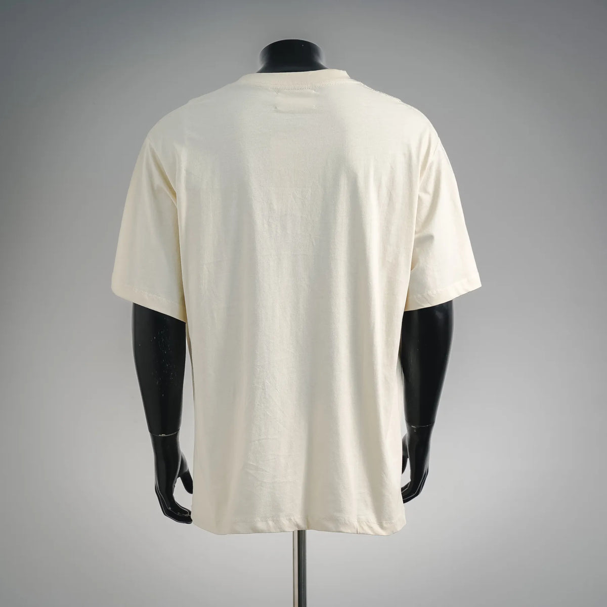Back view of off-white short-sleeve T-shirt on mannequin