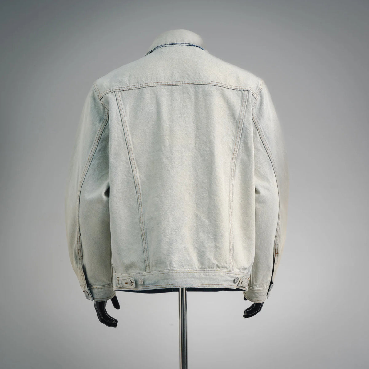 Maison Margiela light-wash denim coat, back view with button closure and seams