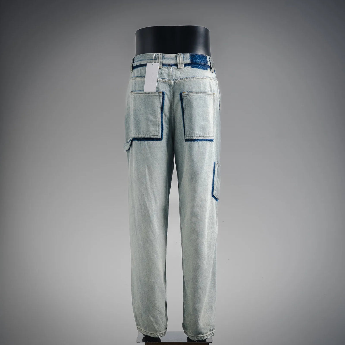 Light blue denim pants with back patch pockets and contrast topstitching