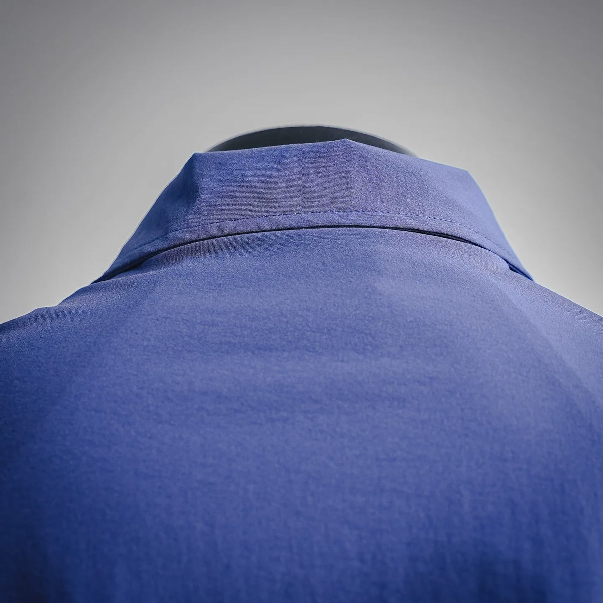 Blue jacket collar and upper back with structured stand collar