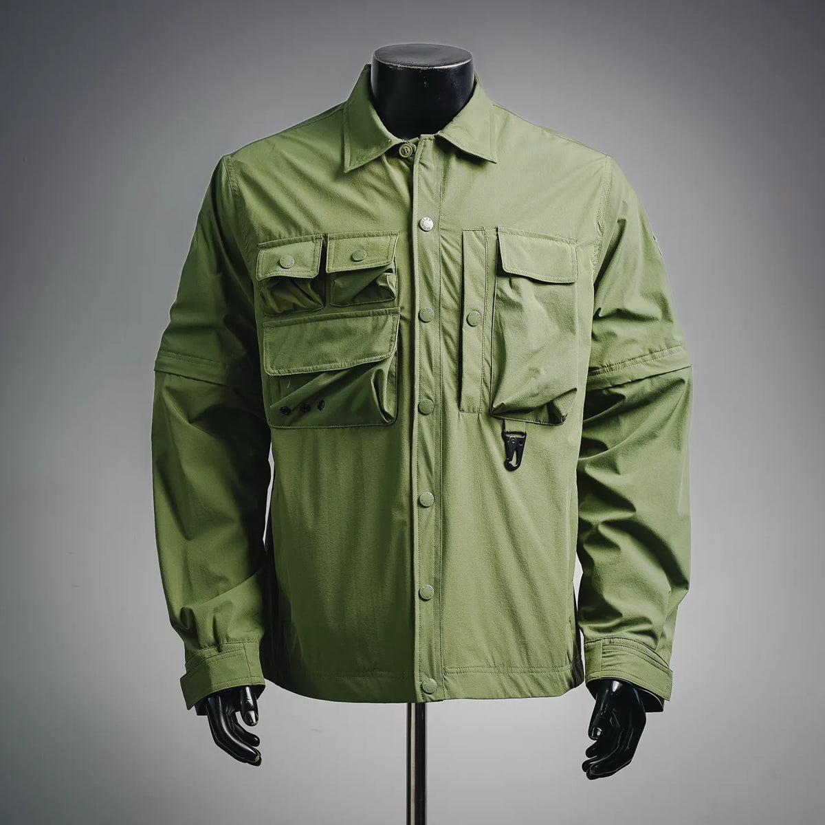 Moncler long green jacket with button front and chest flap pockets