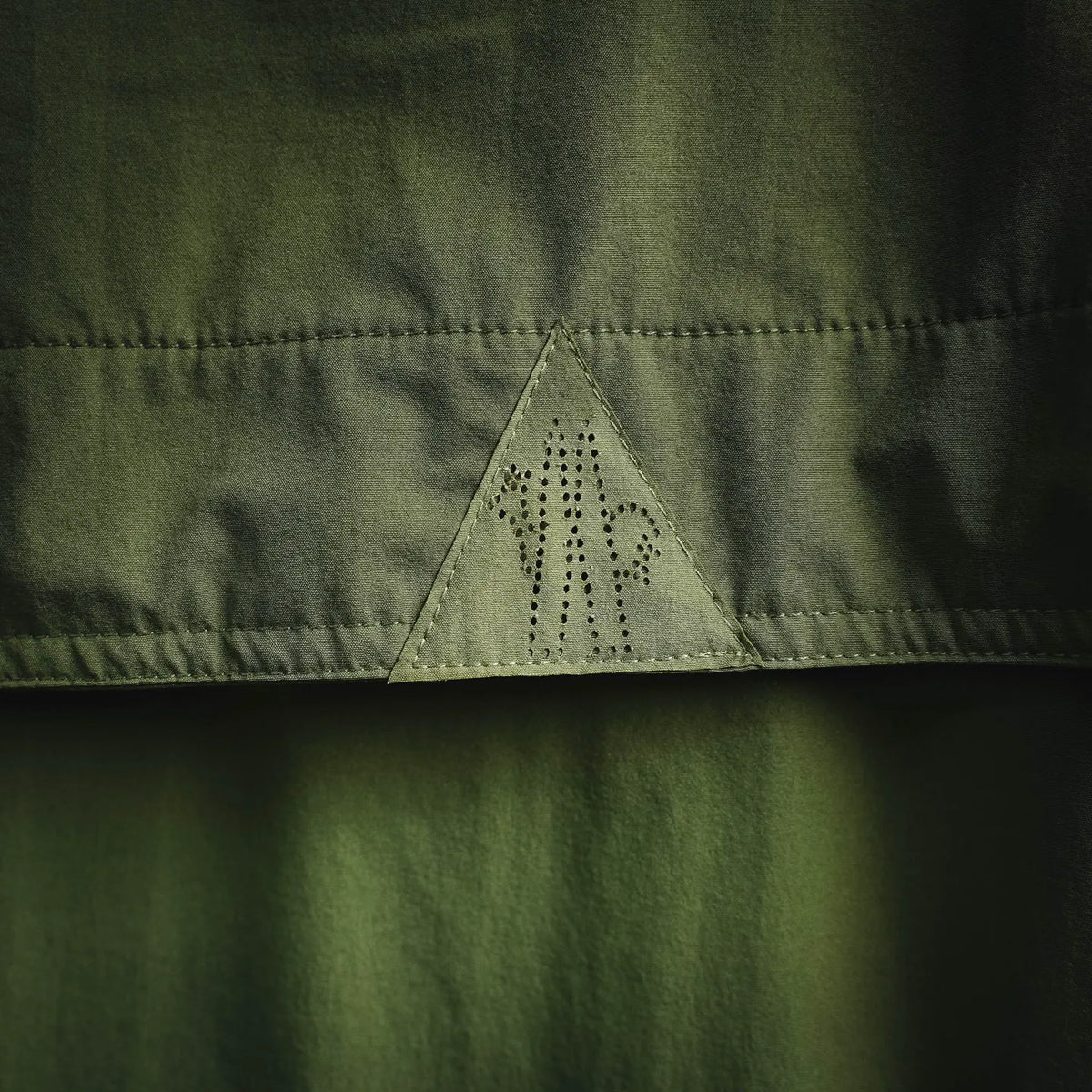 Moncler long jacket triangular perforation panel on upper front