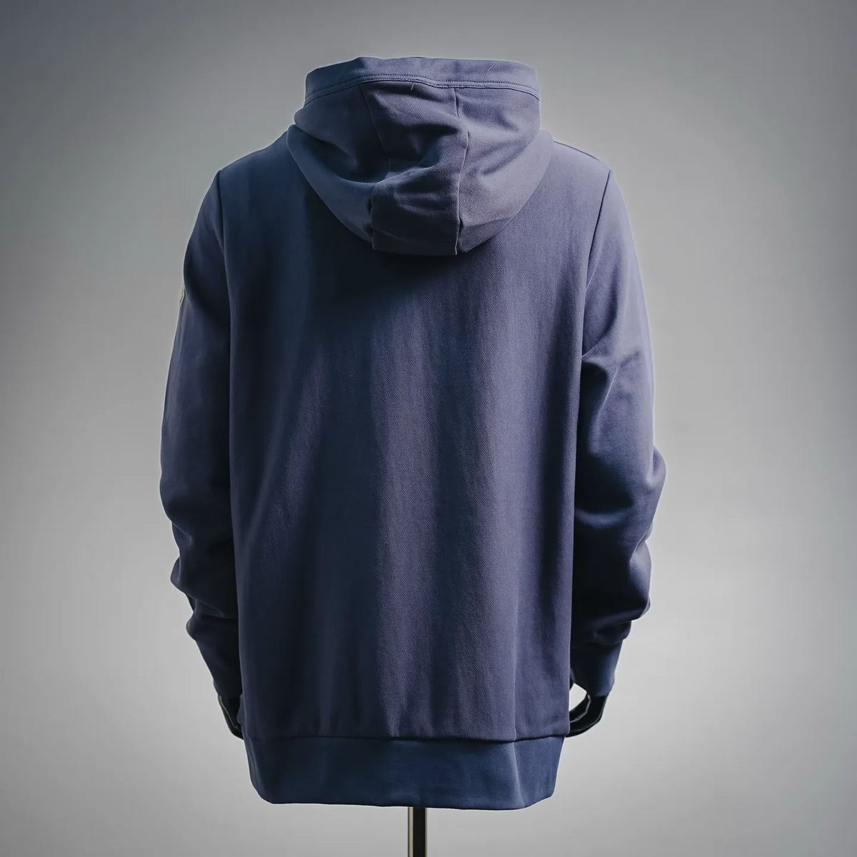 Navy Moncler long pullover hoodie with hood, back view