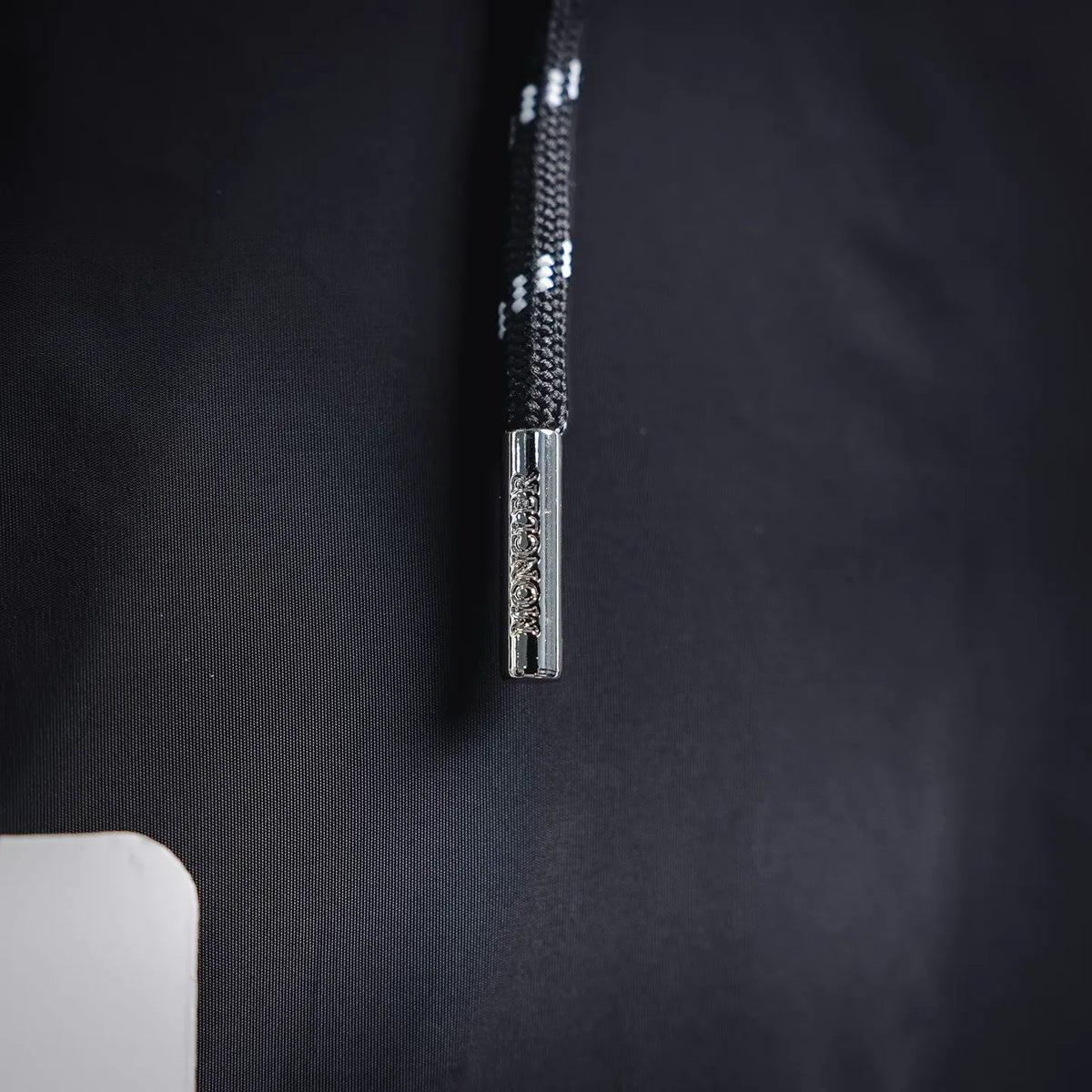 Moncler coat zipper with metal pull and textured fabric surround