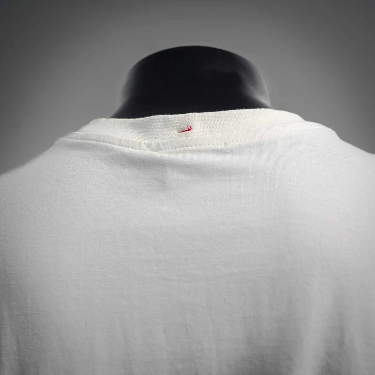 White T-shirt collar back with small embroidered logo