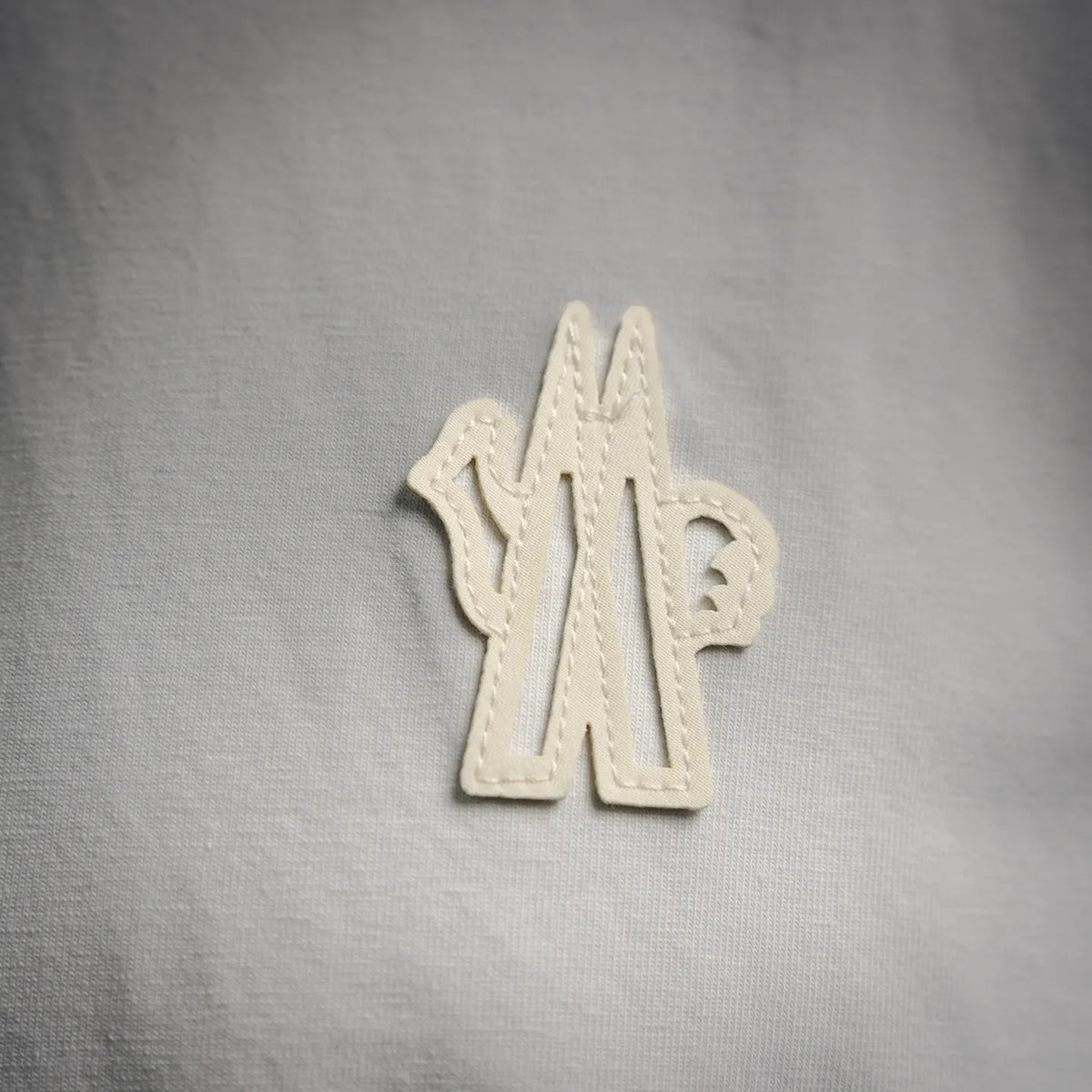 White T-shirt chest with embroidered logo patch