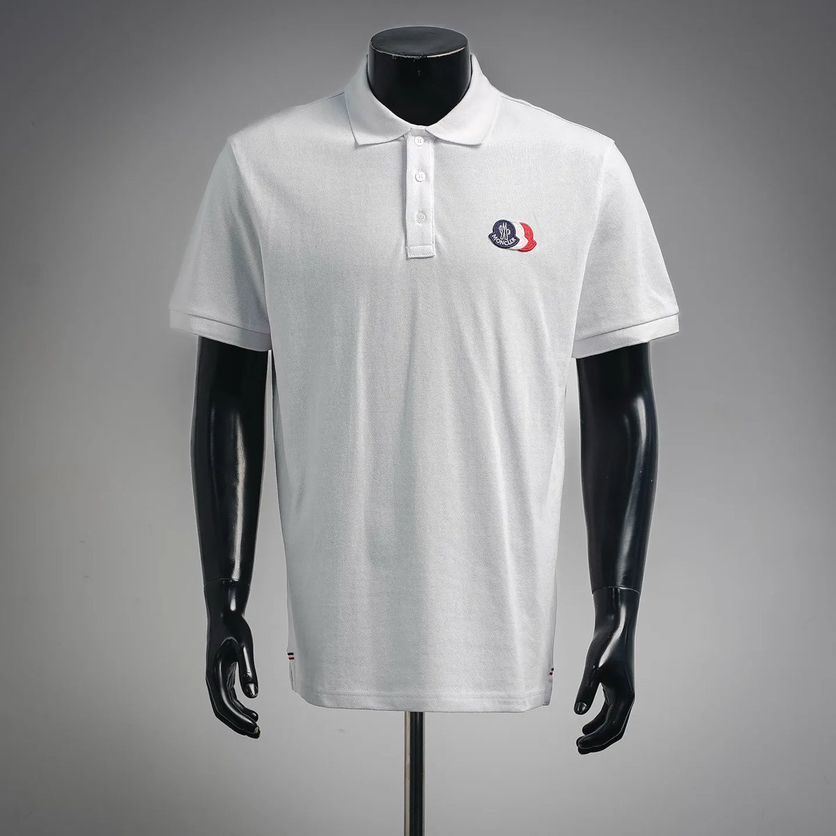 White Moncler polo shirt with button placket and embroidered chest logo