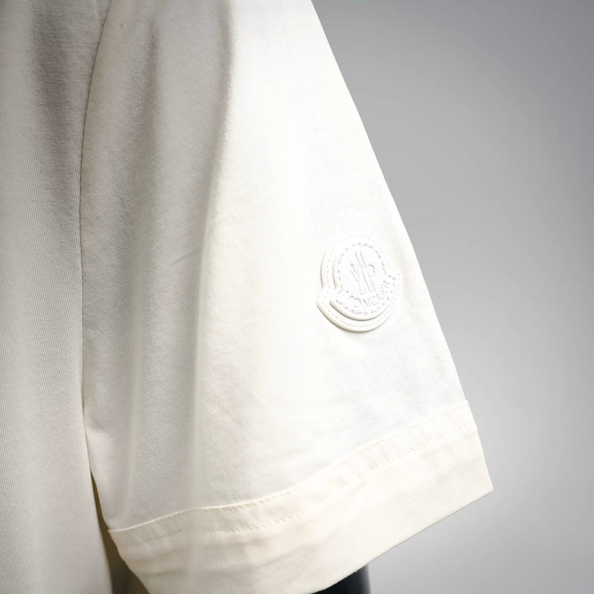 Moncler light cream T-shirt with circular logo patch on sleeve