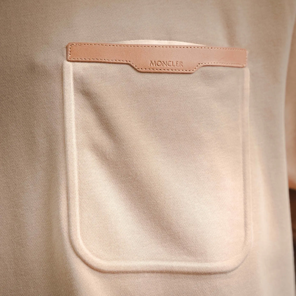 Moncler beige chest pocket with leather brand patch