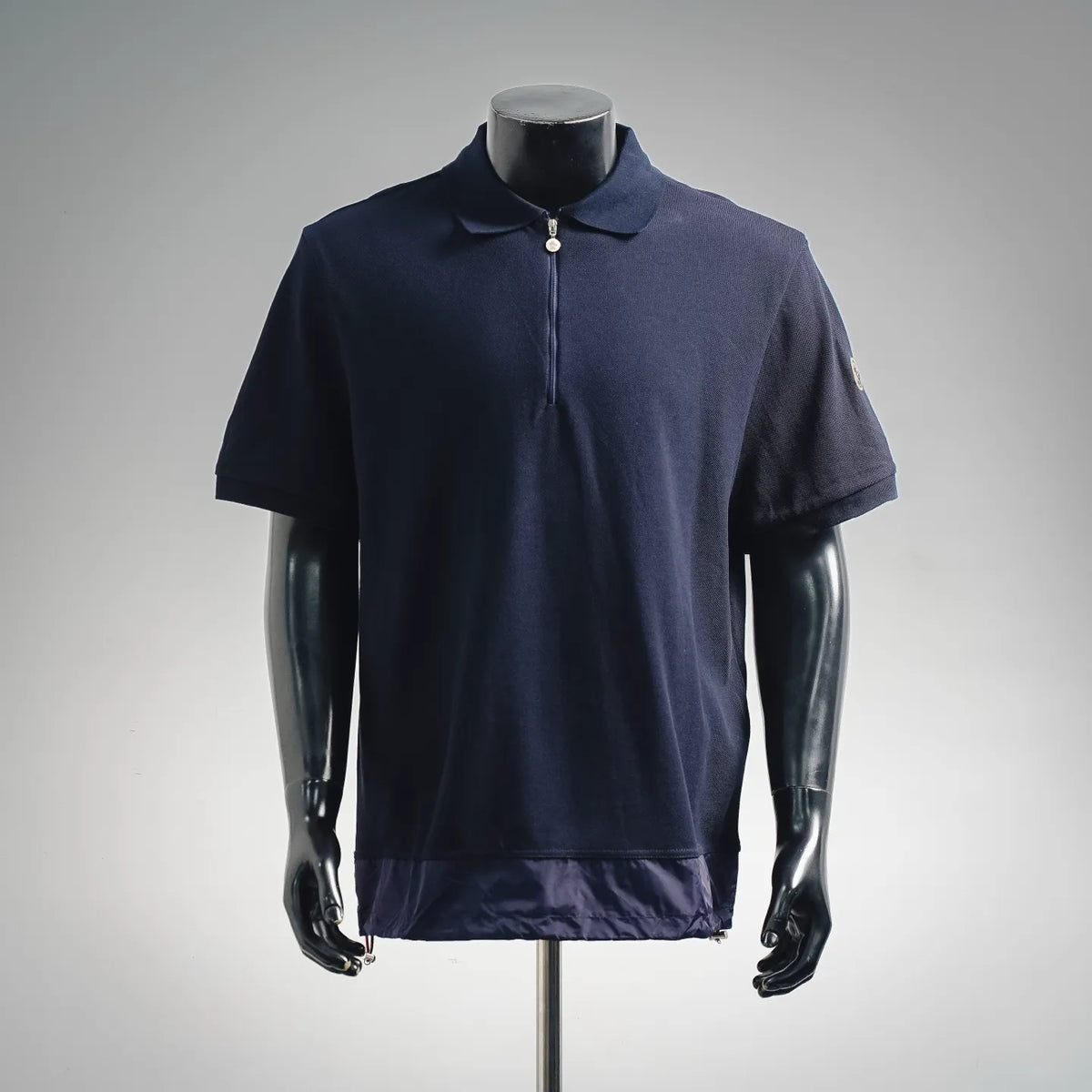 Moncler navy short-sleeve polo with full zip and buttoned collar