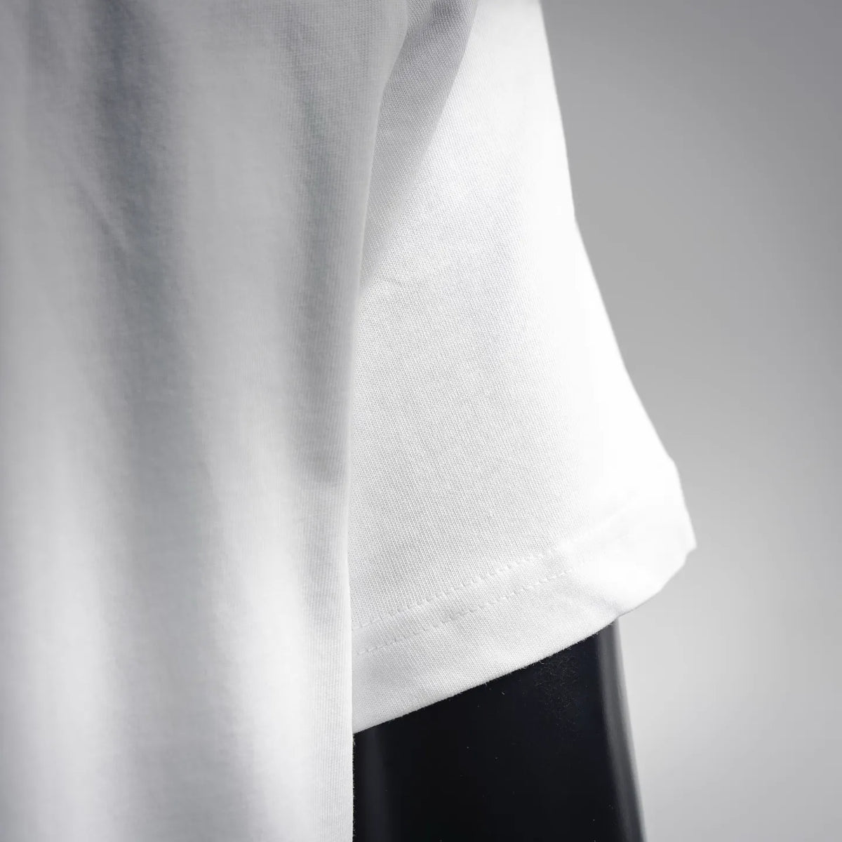 White T-shirt side and bottom hem close-up