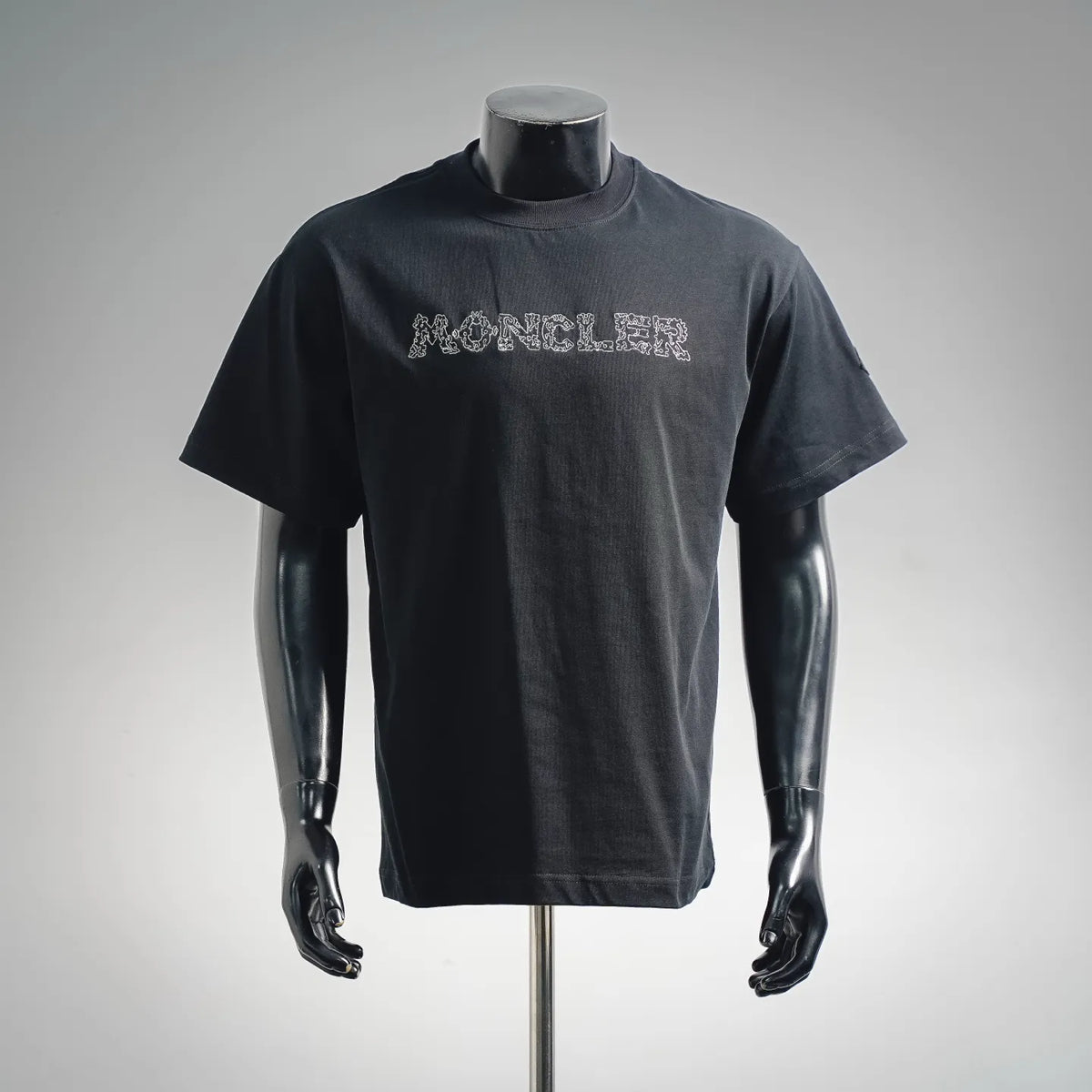 Moncler dark T-shirt with front logo graphic across chest