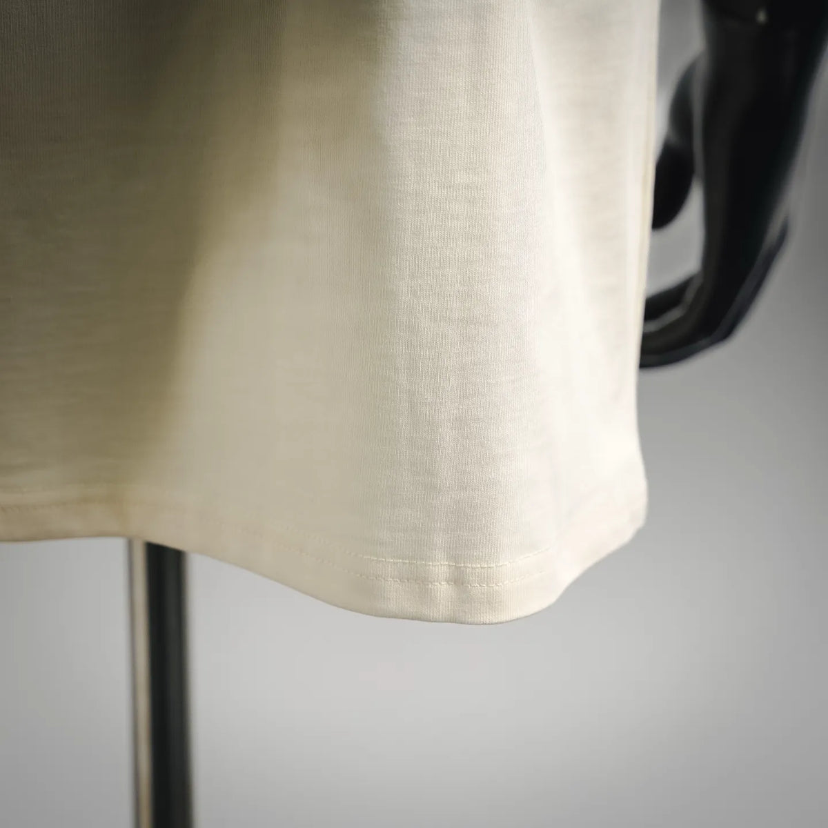 Cream T-shirt hem and short sleeve cuff detail, smooth cotton jersey fabric