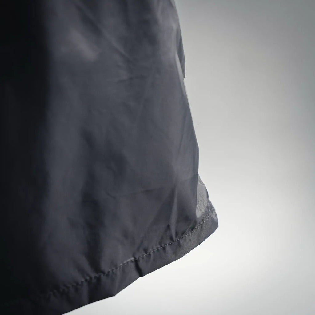 Moncler black swim shorts with smooth fabric and curved side hem