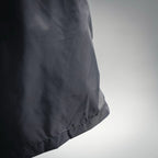 Moncler black swim shorts with smooth fabric and curved side hem