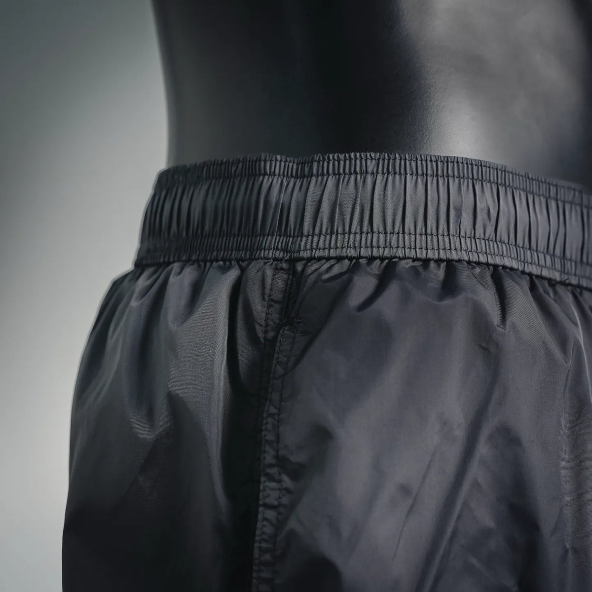 Moncler black swim shorts with textured elastic waistband and stitched front