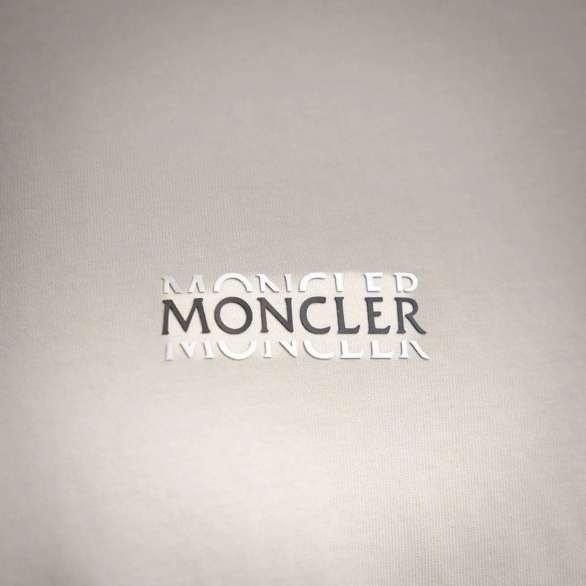 Moncler logo print on ivory T-shirt fabric