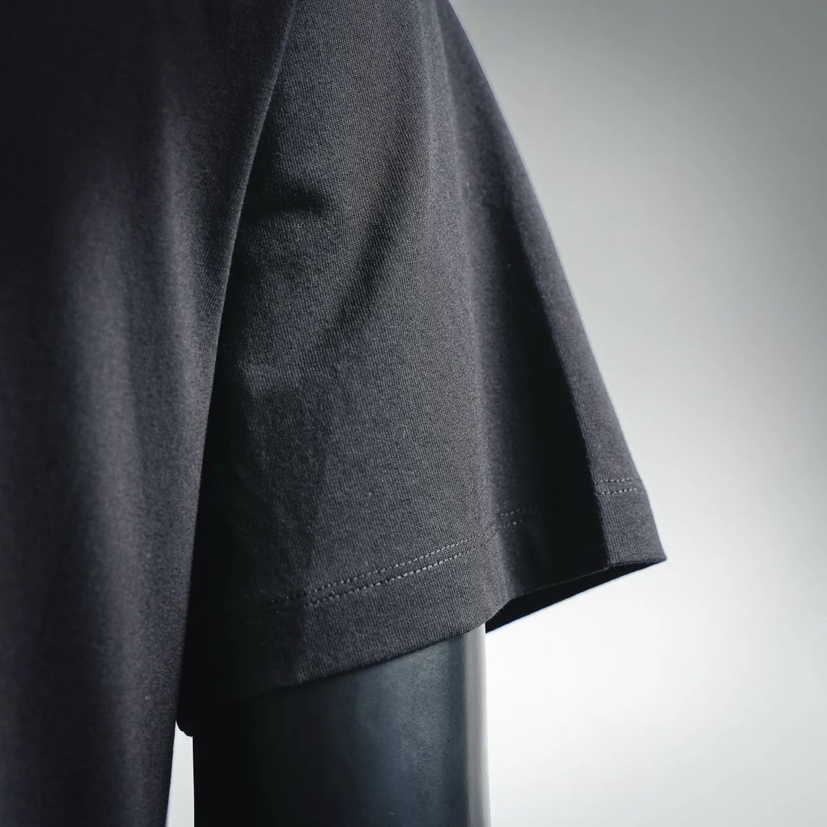 Black Moncler short sleeve seam with stitched hem and relaxed fit