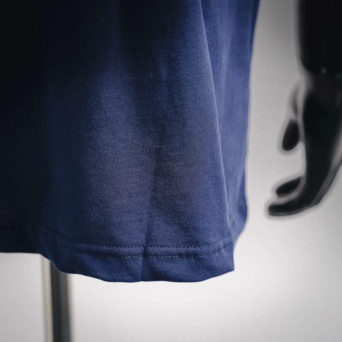 Navy short-sleeve T-shirt hem with double-stitched edge