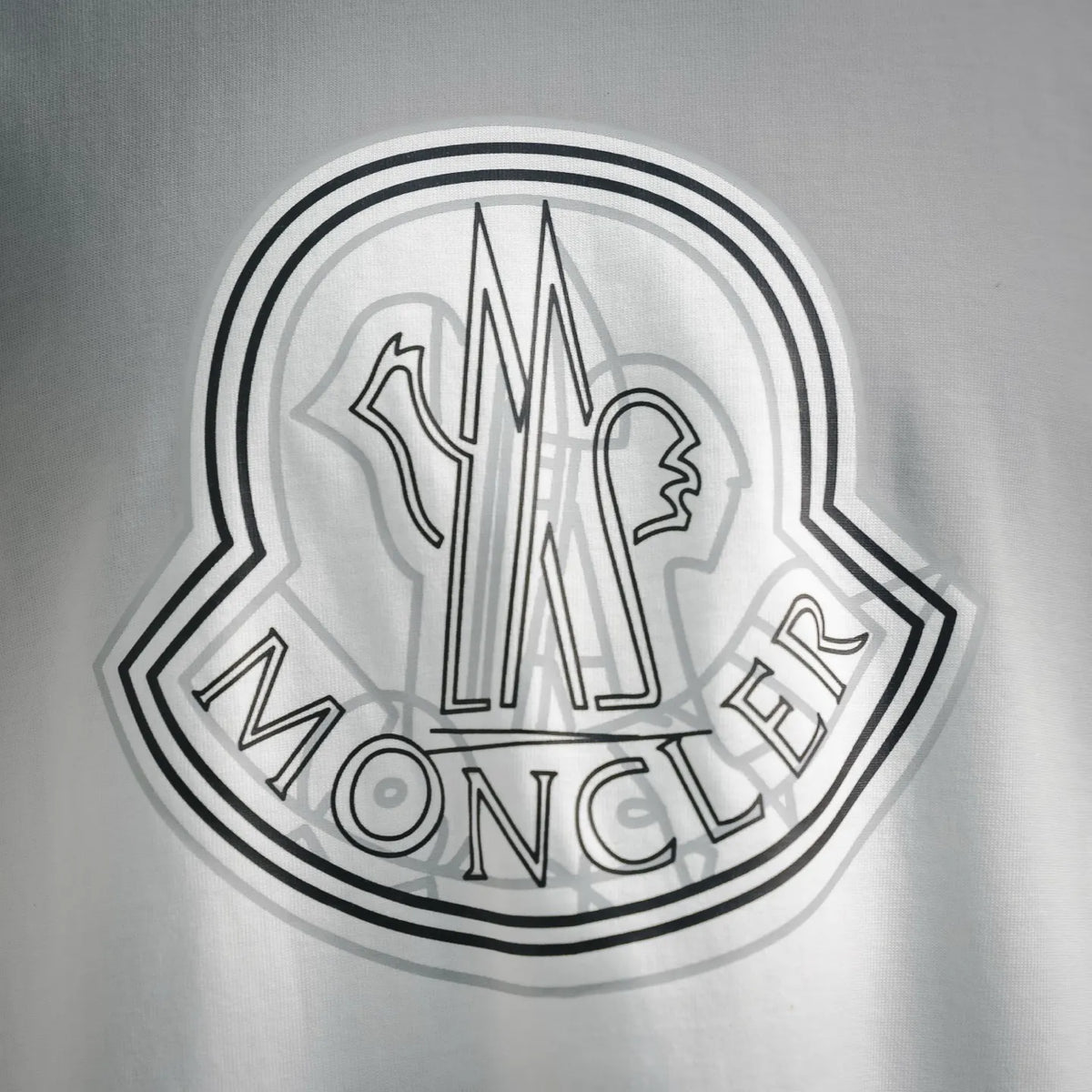 White Moncler T-shirt with large monochrome crest logo front graphic