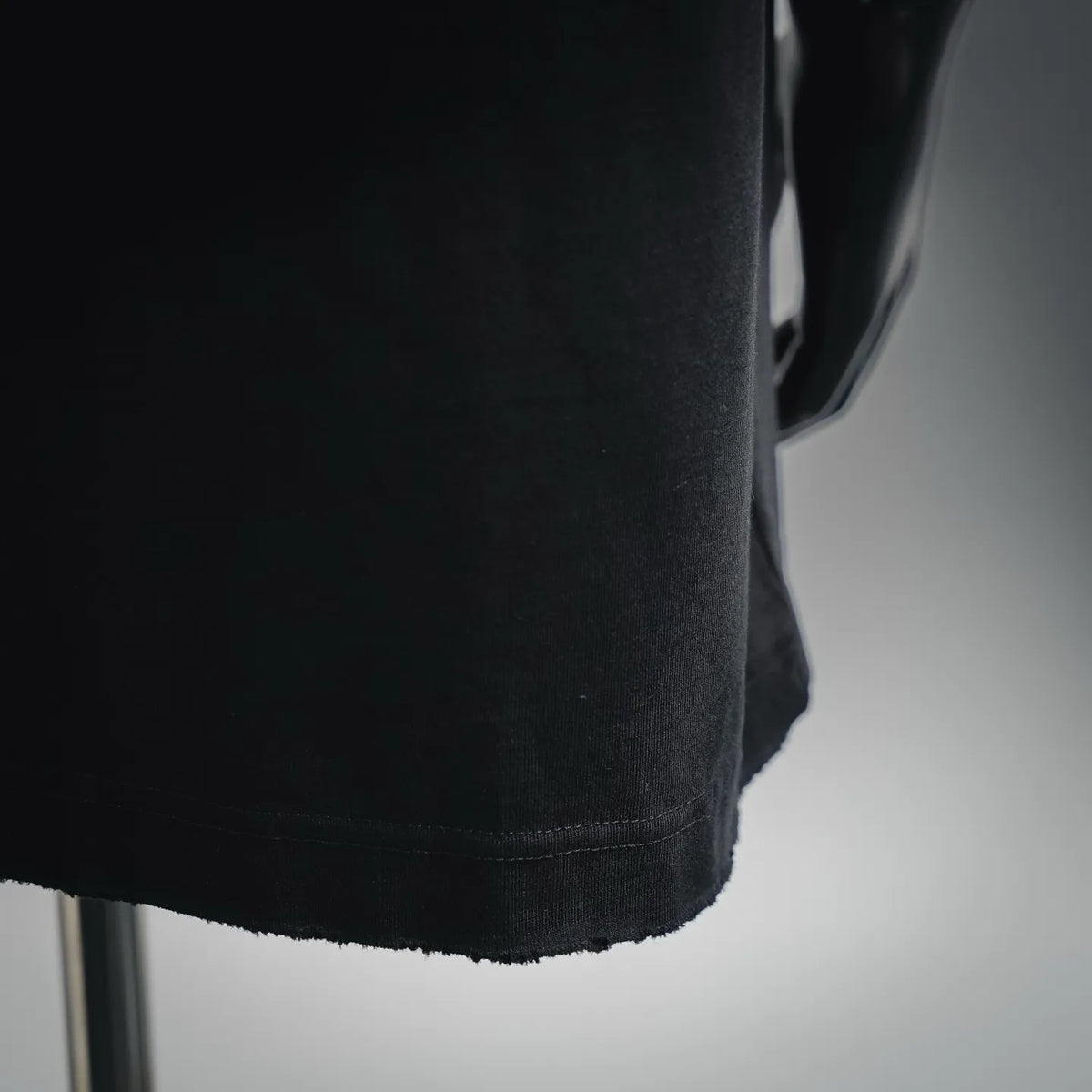 Black Moncler short-sleeve T-shirt side seam and bottom hem