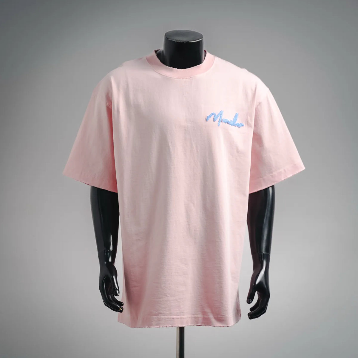 Pink crew-neck T-shirt with blue Moncler logo on the left chest
