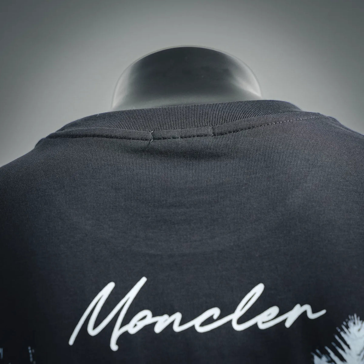 Moncler short-sleeve T-shirt collar detail, dark gray with Moncler script on back