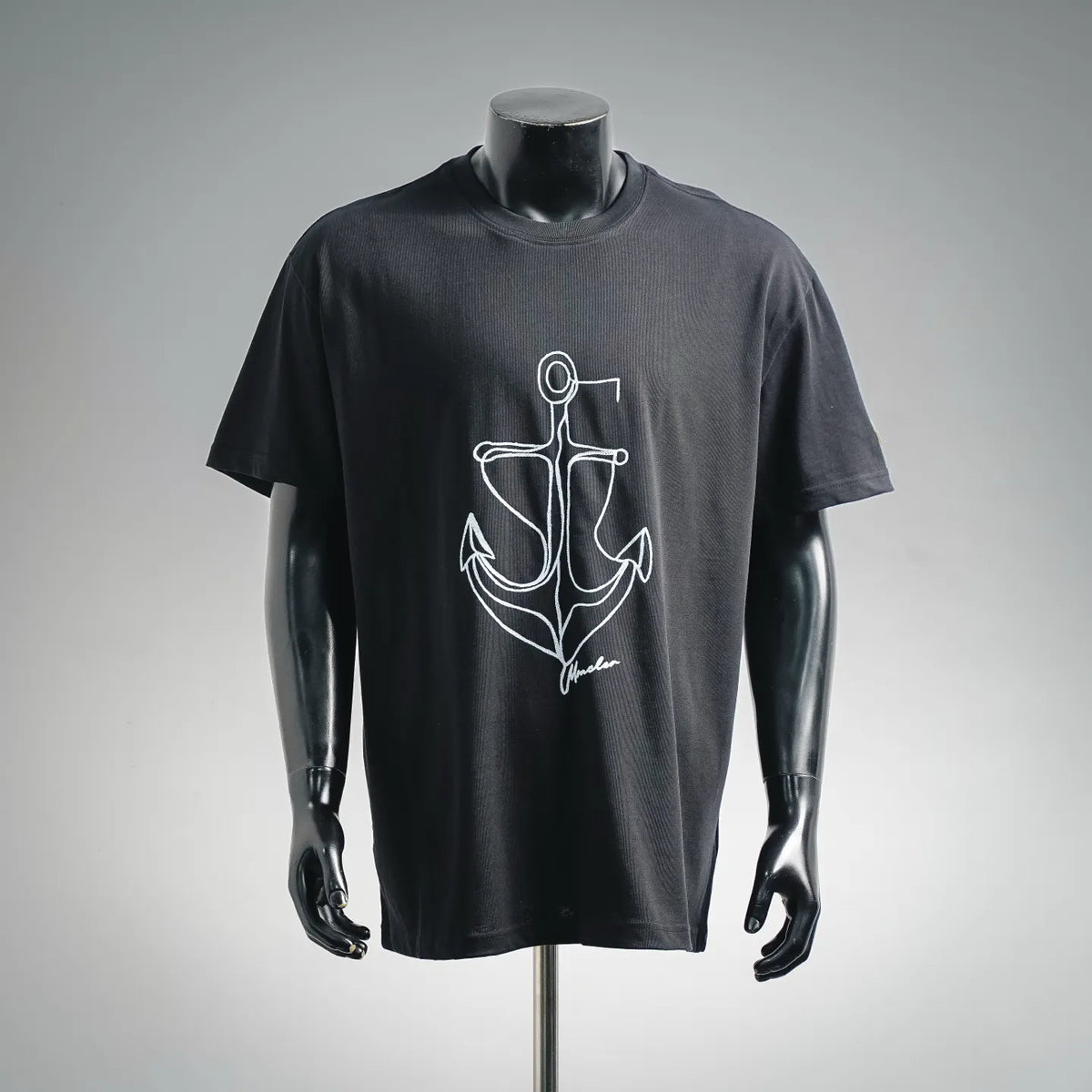 Black crew-neck T-shirt with white anchor graphic print on the front