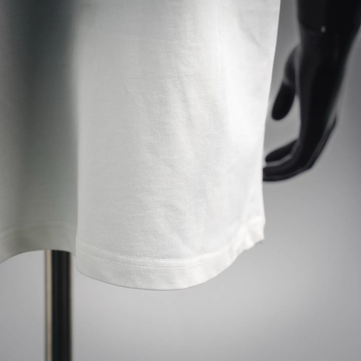 White T-shirt hem with double-stitching