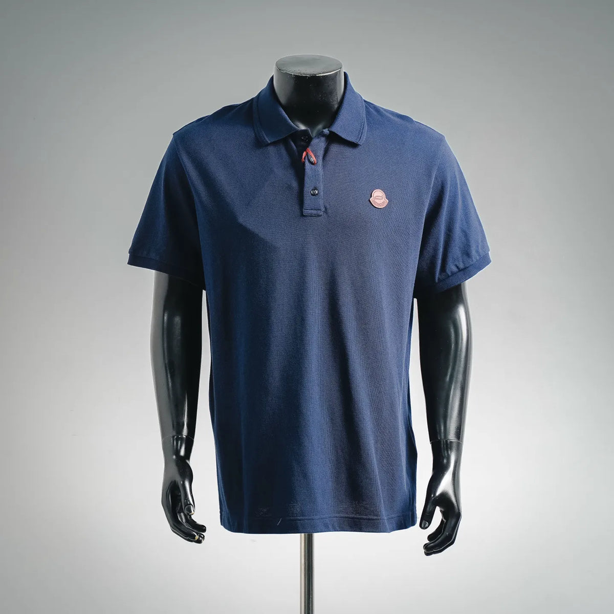 Men's Moncler short-sleeve polo shirt in dark blue, front placket and logo patch