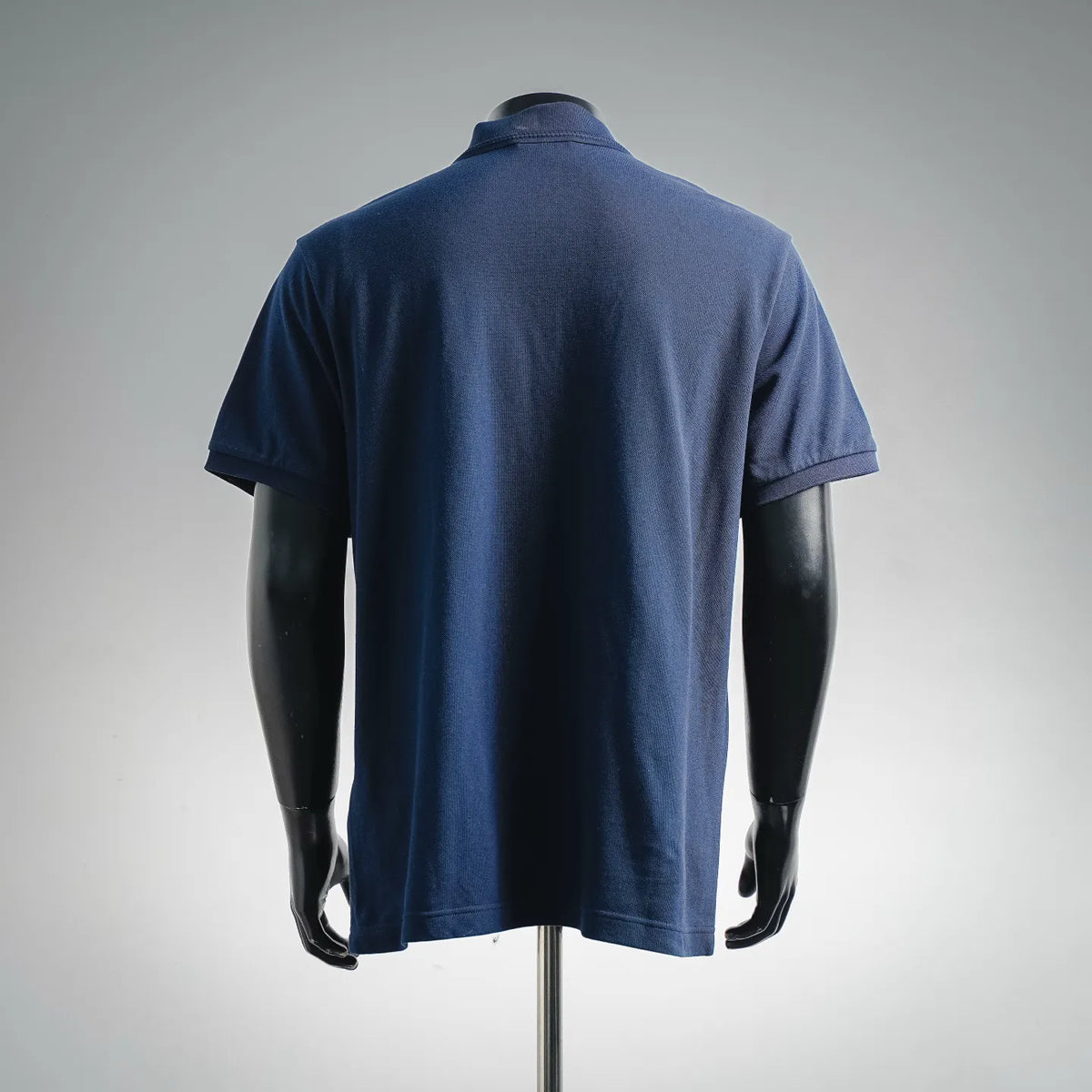 Men's Moncler short-sleeve polo shirt, back view in dark blue