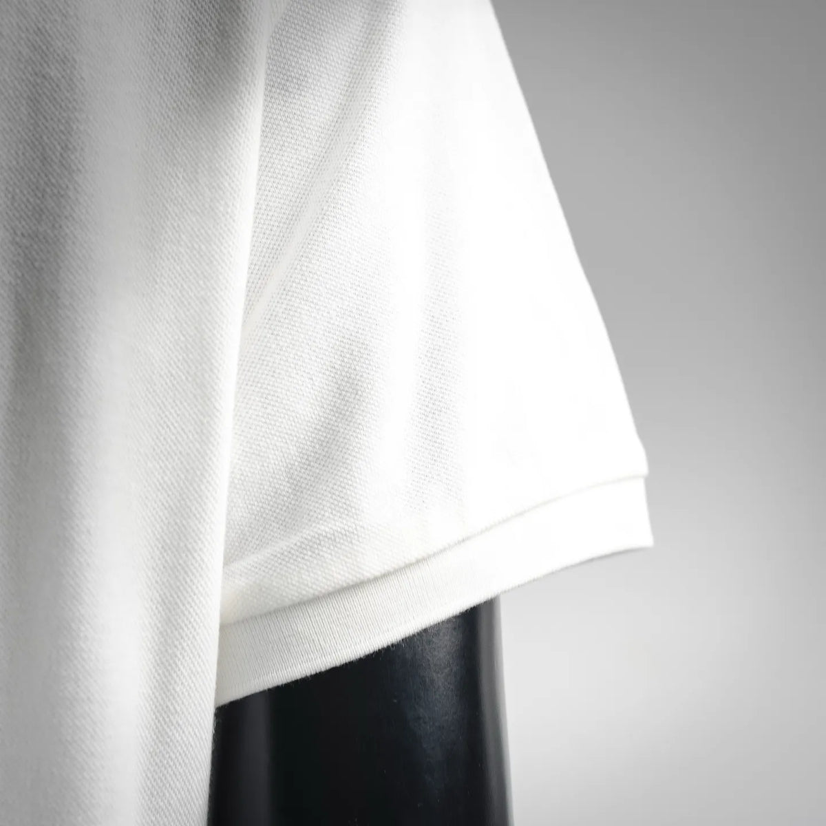 Moncler white polo shirt side hem with short-sleeve cuff detail