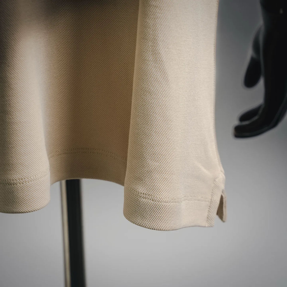 Moncler beige short-sleeve polo shirt cuff and side hem detail