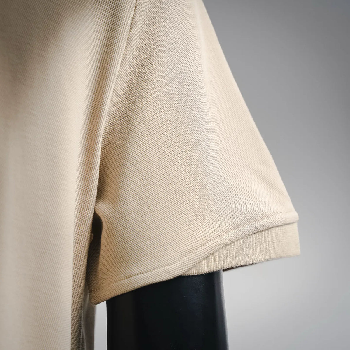 Moncler beige polo shirt sleeve and side seam hem