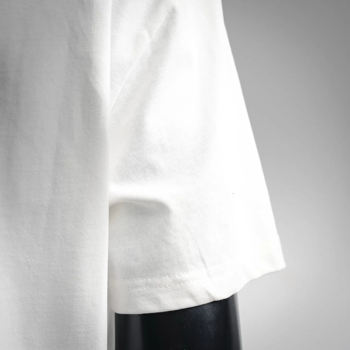 White T-shirt sleeve hem with double-stitched edge