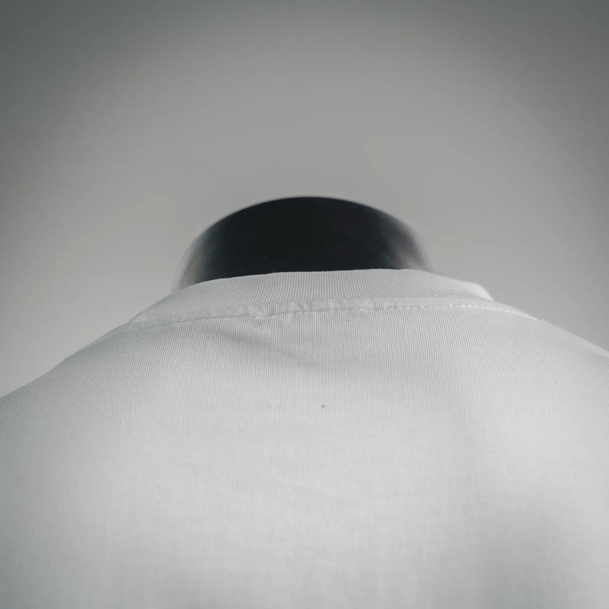 White T-shirt back neckline close-up on a mannequin