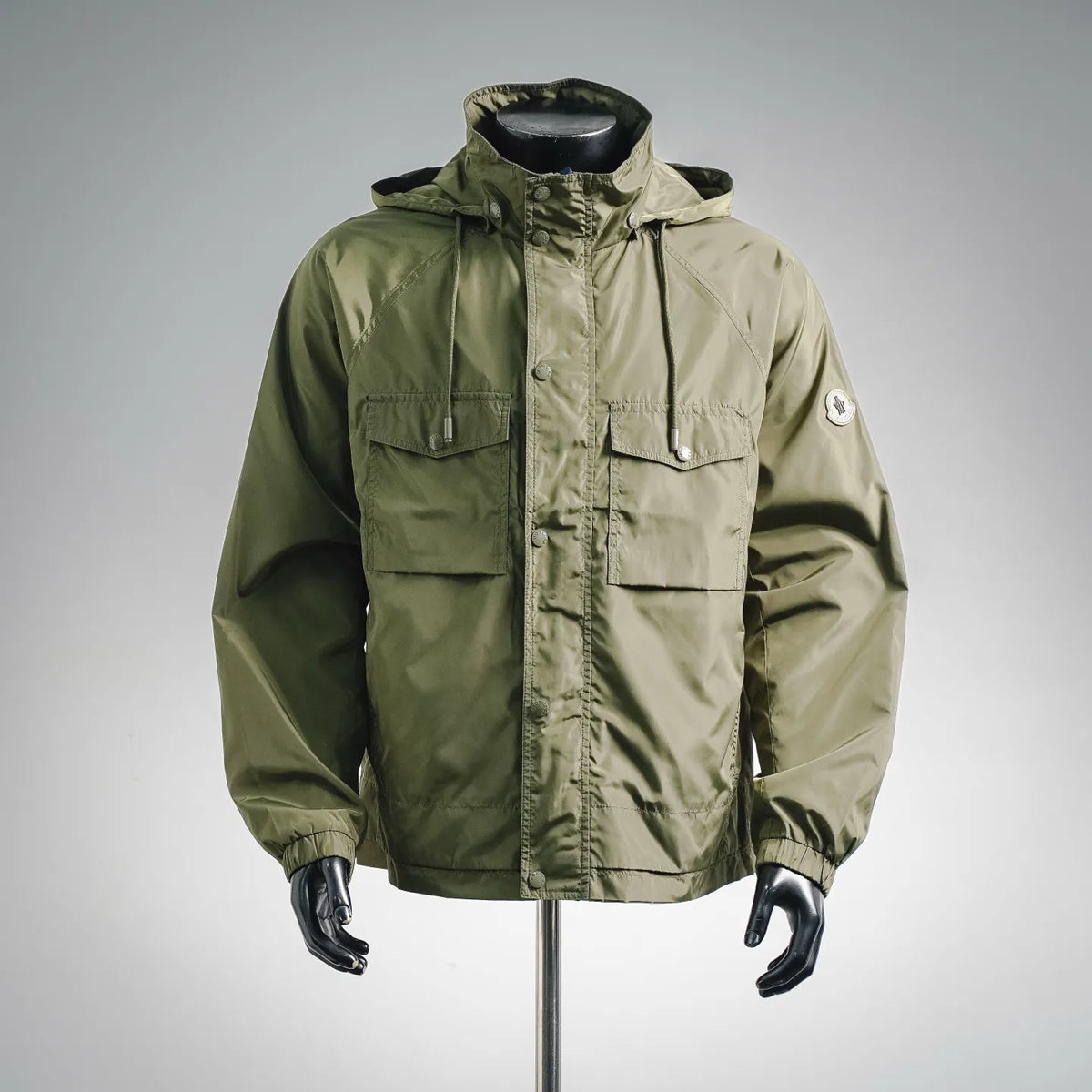 Men's olive Moncler hooded coat with zip front and flap chest pockets