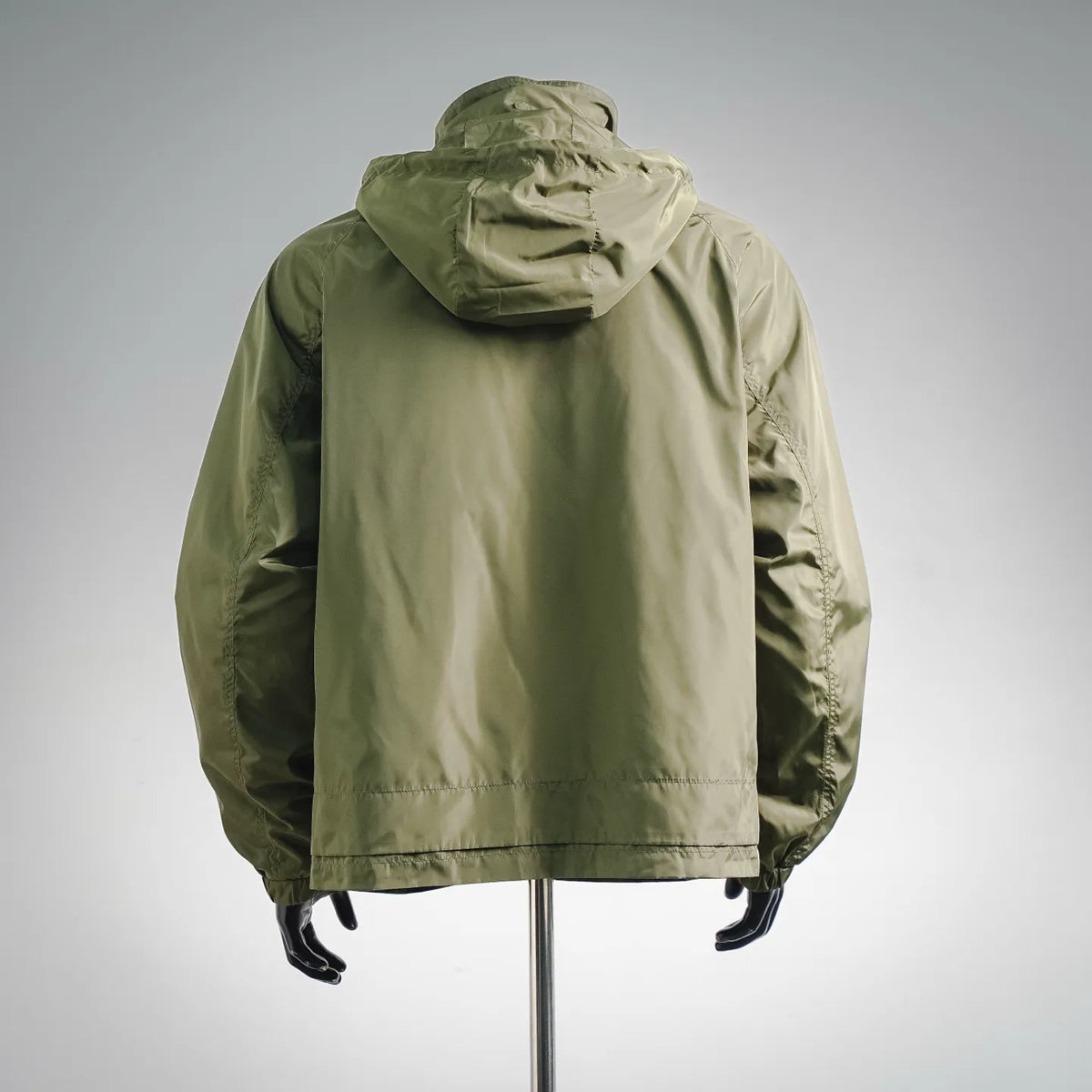 Olive Moncler hooded coat, back view with gathered hood and elastic cuffs