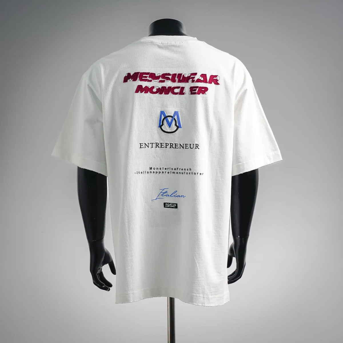 White short-sleeve T-shirt with red back print and blue M-style logo