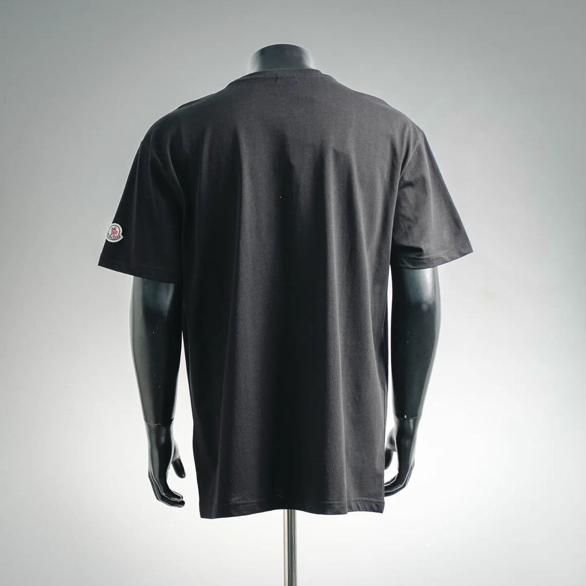 Men's Moncler short-sleeve t-shirt, black; back view with small left chest patch