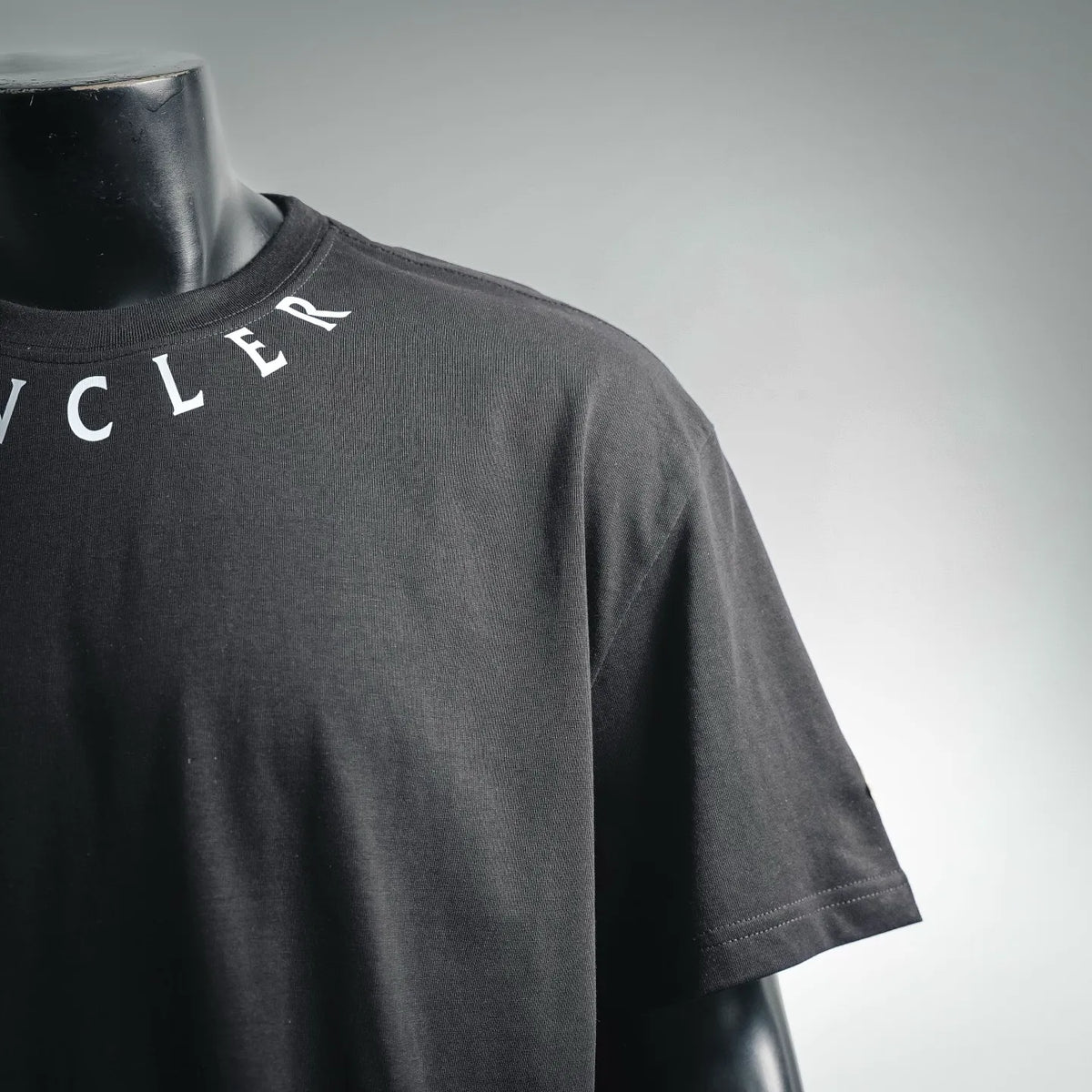 Men's Moncler short-sleeve t-shirt, black; side view with sleeve and logo edge