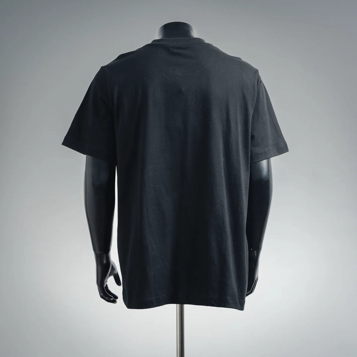 Men's black short-sleeve T-shirt on a mannequin, plain back