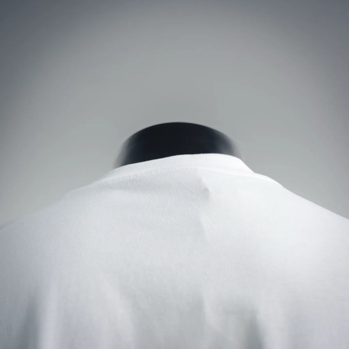 White Moncler T-shirt collar and upper back, smooth fabric.