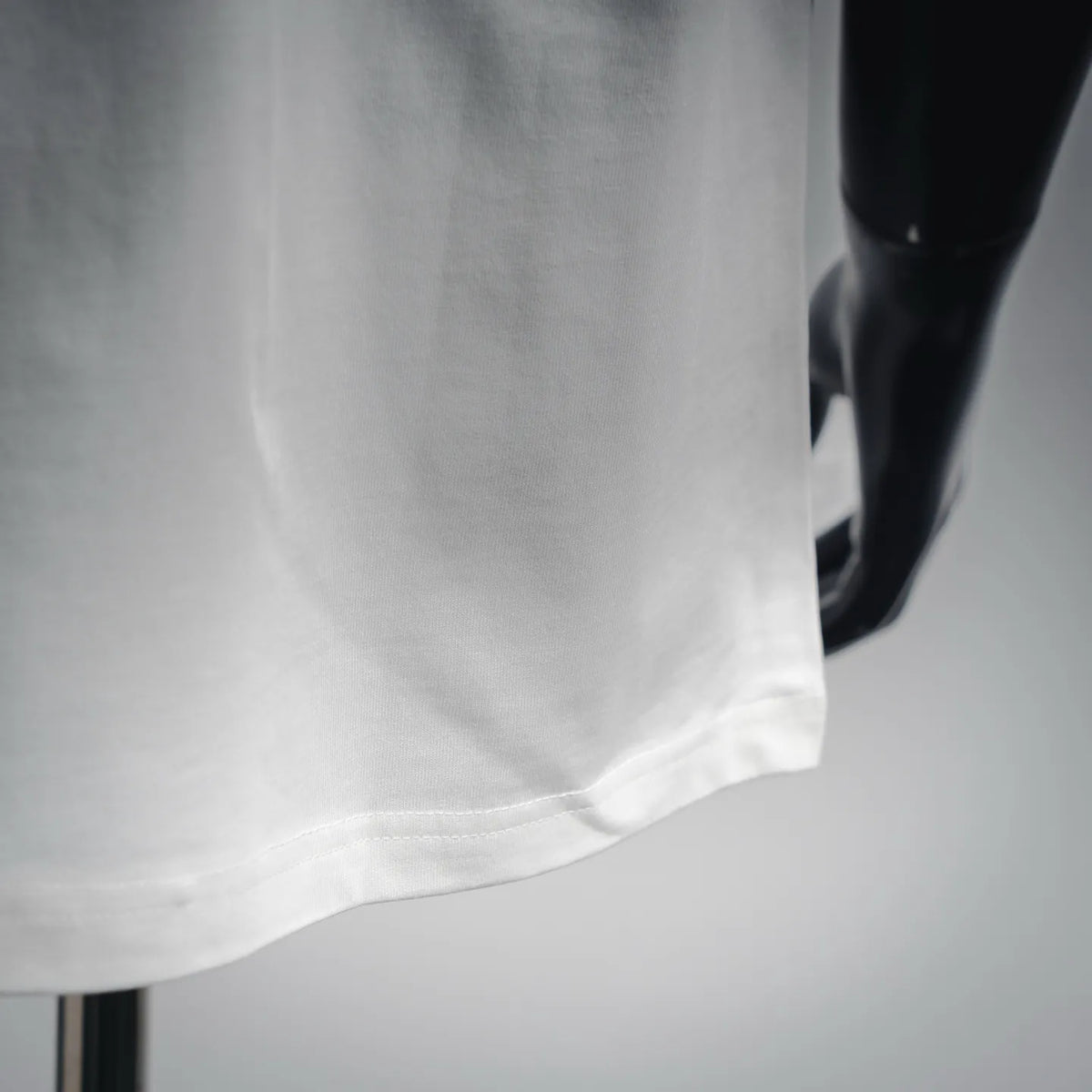 White T-shirt hem and side seam detail