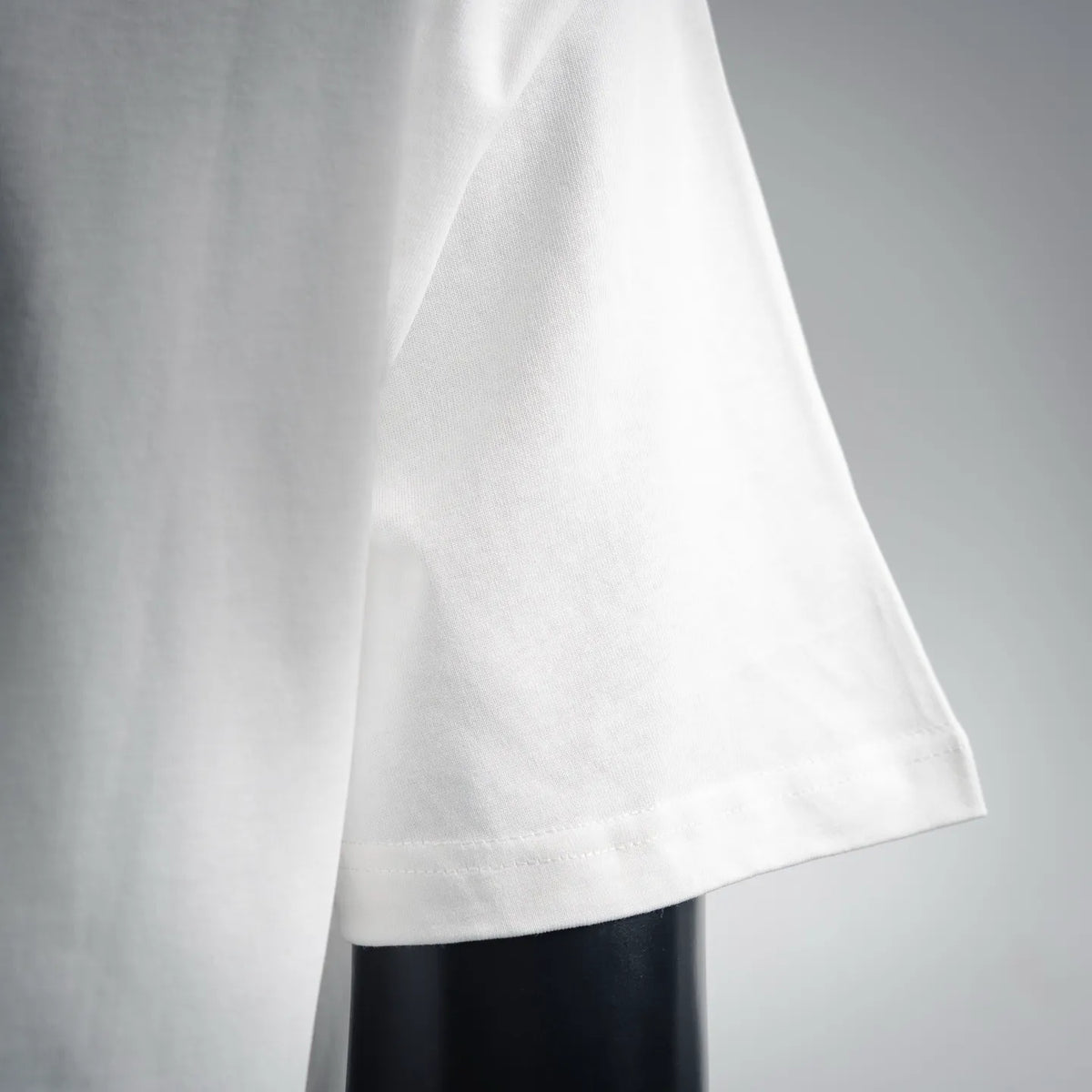 White T-shirt lower hem with stitched edge