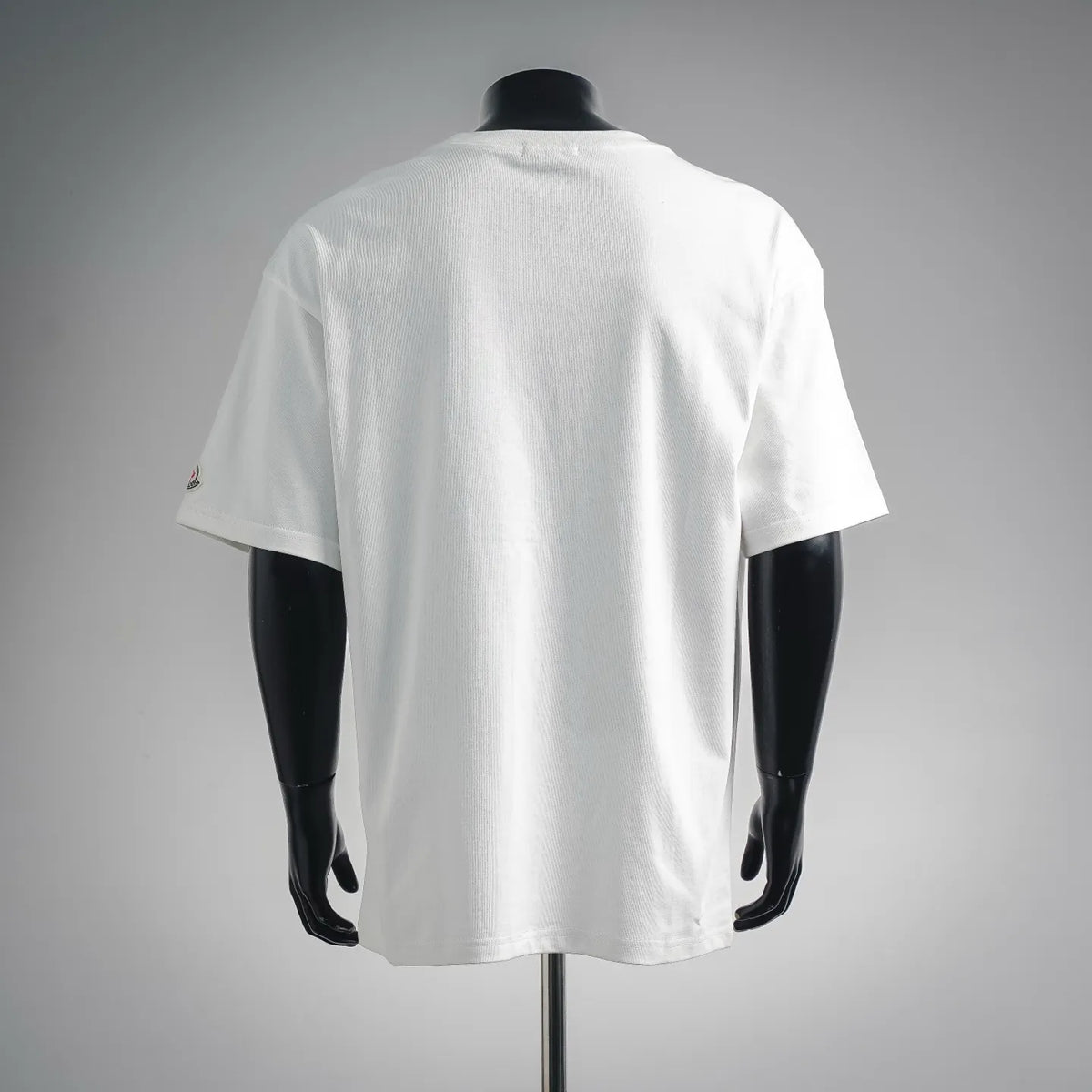 White short-sleeve T-shirt with solid back and crew neckline.