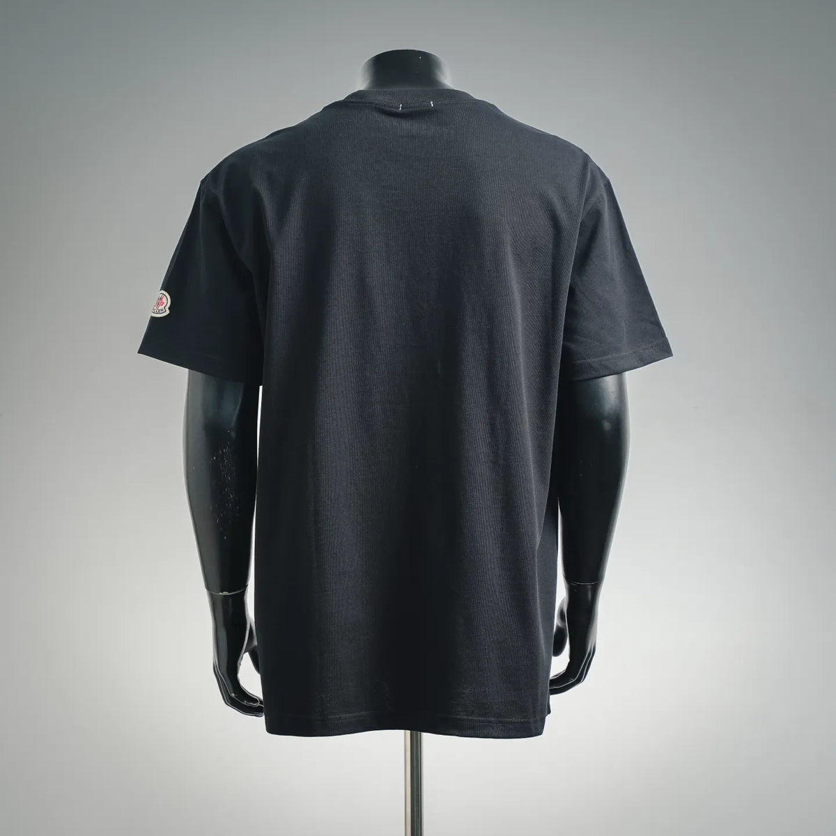 Moncler black short-sleeve T-shirt, back view with left shoulder patch logo