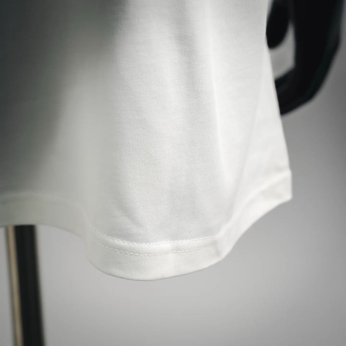 White Moncler T-shirt lower front hem detail