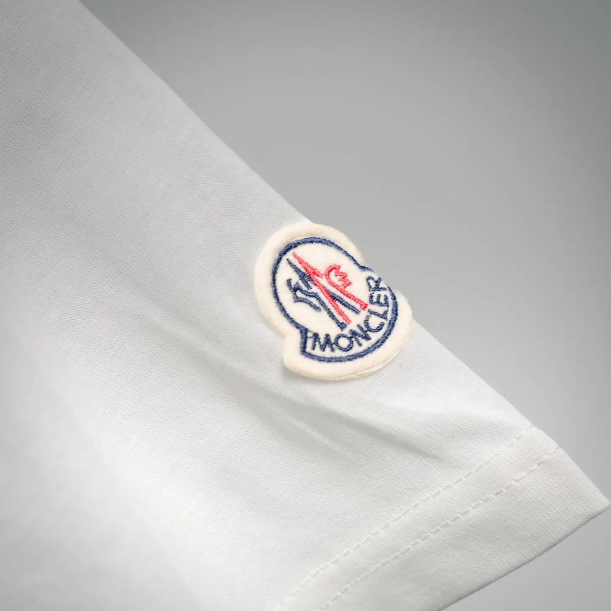 White Moncler T-shirt with small round sleeve logo patch