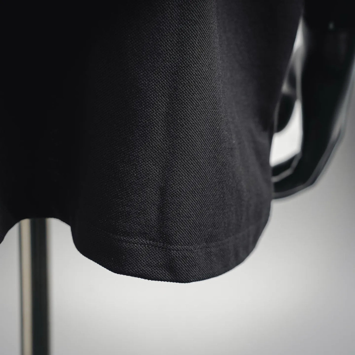 Dark polo shirt sleeve hem with ribbed trim